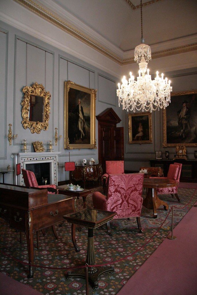 A suite sitting room with a sofa and armchairs